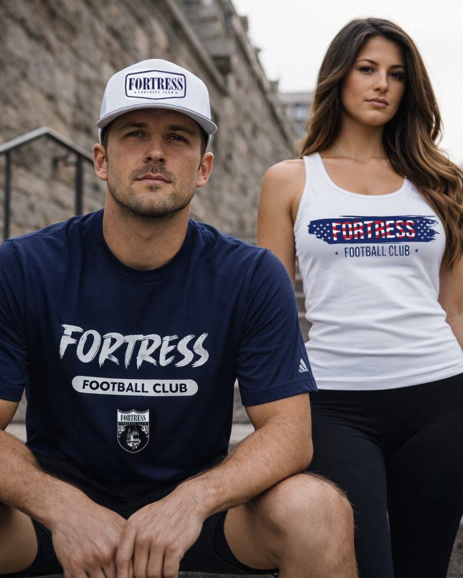 Two people wearing 'Fortress' branded clothing sitting on steps outdoors.